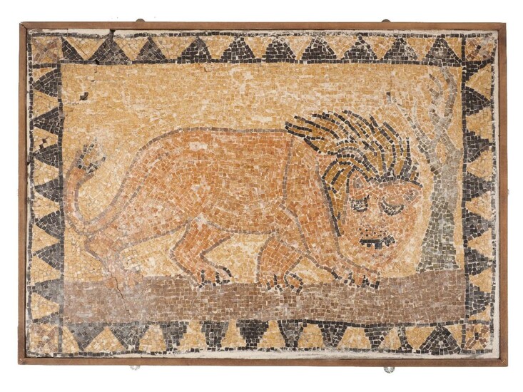 A mosaic panel of a prowling lion, after the antique, 20th century, the border with triangle motifs, in a wood frame, 60 x 85cm