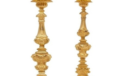 A pair of Baroque style gilt bronze candlesticks