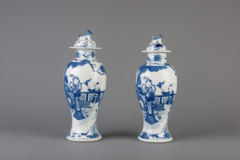 A pair of Chinese blue and white vases and covers …