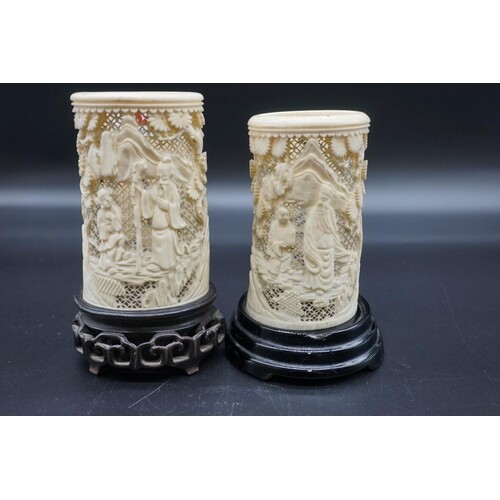 A pair of Chinese carved and pierced ivory tusk vases, 19th ...
