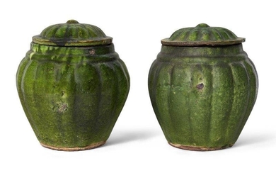 A pair of Chinese pottery green-glazed jars and covers, Ming dynasty