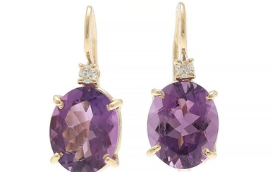 NOT SOLD. A pair of amethyst and diamond ear pendants each set with an oval-cut...