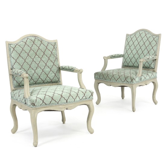 A pair of broad painted Swedish Rococo armchairs. Mid 18th century. (2).