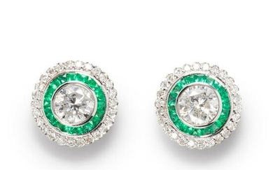 A pair of diamond, emerald and eighteen karat white