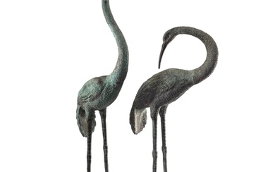 A pair of large patinated metal garden models of storks, mod...