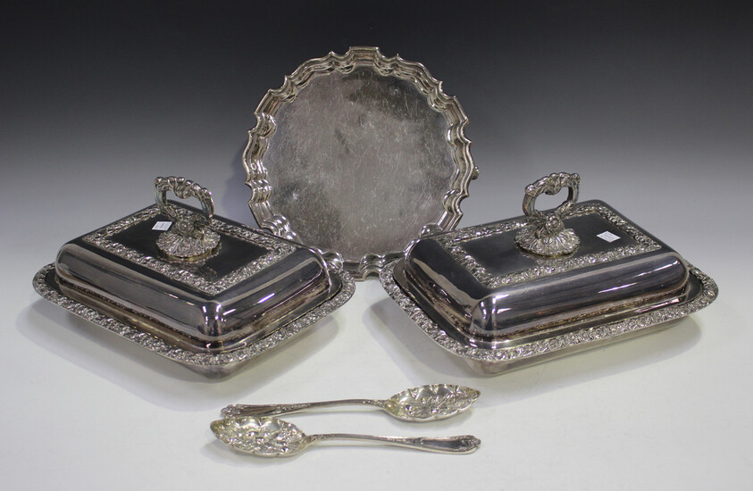 A pair of plated rectangular entrées dishes, covers and handles, cast with foliate decoration