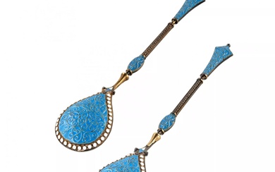 A pair of silver spoons with enamel.