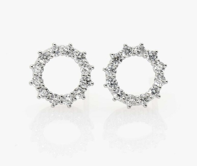 A pair of stud earrings with brilliant cut diamonds