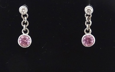 A pair of white gold drop earrings set with diamonds with pi...