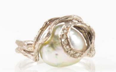 A pearl and diamond dress ring.