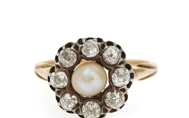 A pearl and diamond ring set with a cultured pearl encircled by eight old-cut diamonds, mounted in 18k gold. Size 57. Circa 1910.