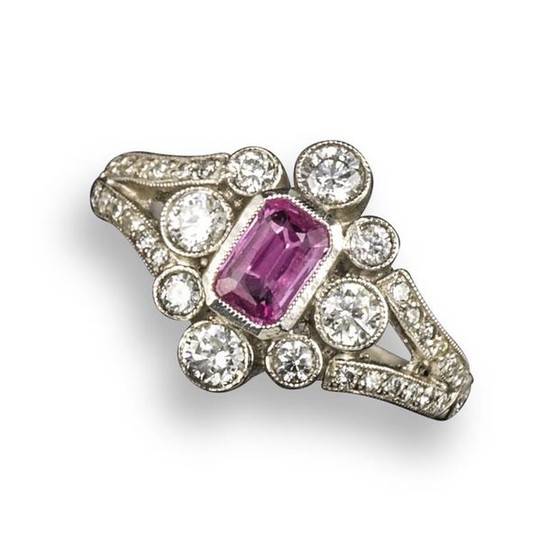 A pink sapphire and diamond cluster ring, centred...