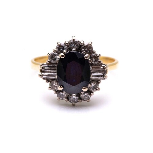 A sapphire and diamond cluster ring in 18ct gold, consisting...