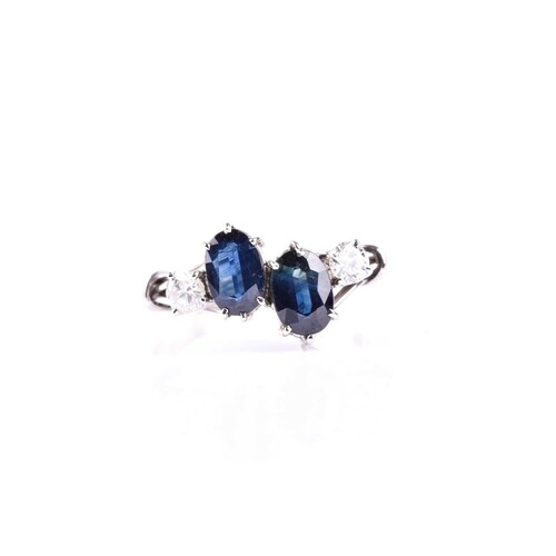 A sapphire and diamond four stone ring, the oval cut sapphir...