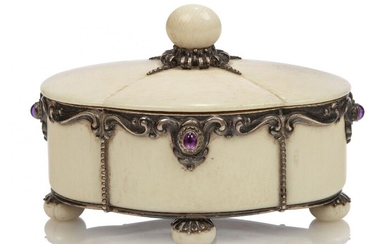 A silver and ivory box and cover with amethyst cabochons...