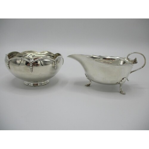 A silver sauce boat by Mappin & Webb, Sheffield 1928, with a...