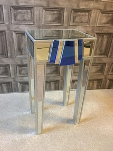 AN ART DECO MIRRORED GLASS TABLE