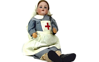 AN EARLY 20TH CENTURY BISQUE HEADED DOLL