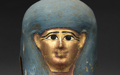 AN EGYPTIAN GILT CARTONNAGE MUMMY MASK PTOLEMAIC PERIOD, 332-30 B.C.
