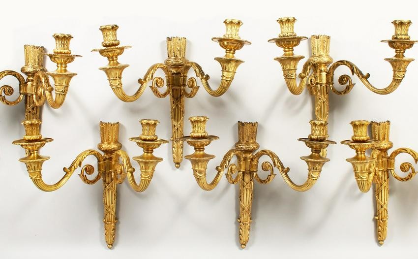 AN IMPORTANT SET OF SIX ORMOLU TWO LIGHT WALL SCONCES