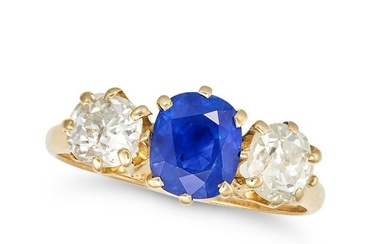 AN UNHEATED KASHMIR SAPPHIRE AND DIAMOND THREE STONE RING in yellow gold, set with a cushion cut