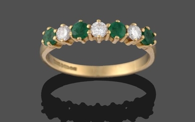An 18 Carat Gold Emerald and Diamond Seven Stone Ring,...