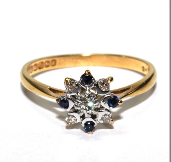 An 18 carat yellow gold ring set with diamonds and sapphire