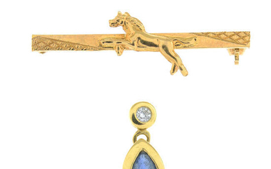 An 18ct gold gem-set pendant and a brooch.