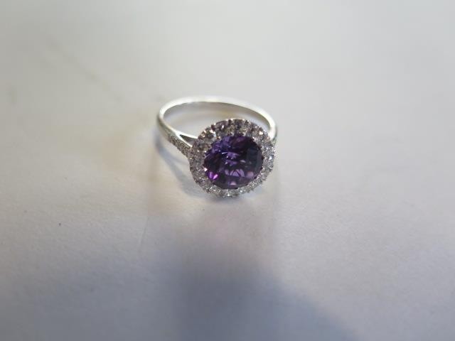 An 18ct white gold amethyst and diamond ring, size N approx ...