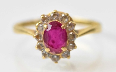 An 18ct yellow gold ruby and diamond set cluster ring,...