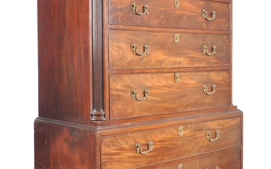 An 18th Century George III mahogany chest on chest of drawers - tallboy. The flared edge pediment top with set over short and deep drawer configuration to both sections. The drawers having decorative brass swing swan neck handles and ornate brass...