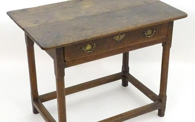 An 18thC oak side table with a rectangular planked top