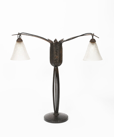 An Art Deco wrought iron two-light lamp in the manner of Edgar Brandt