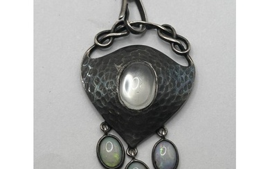 An Art Nouveau pewter and oval moonstone pendant, on a chain...
