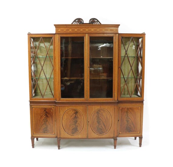 An Edwardian mahogany and crossbanded breakfront display cabinet