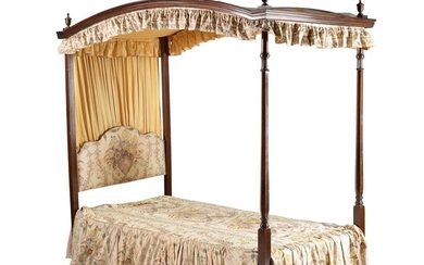 An Edwardian mahogany four poster bed in George III style