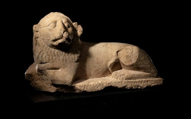 An Egyptian Limestone Recumbent Lion Height 10 3/4 x