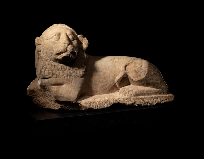An Egyptian Limestone Recumbent Lion