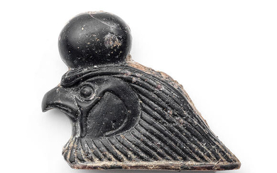 An Egyptian glass falcon head inlay