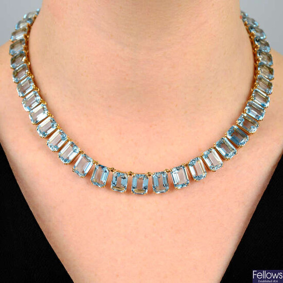An aquamarine rivière necklace, comprising a line of forty-five gems.