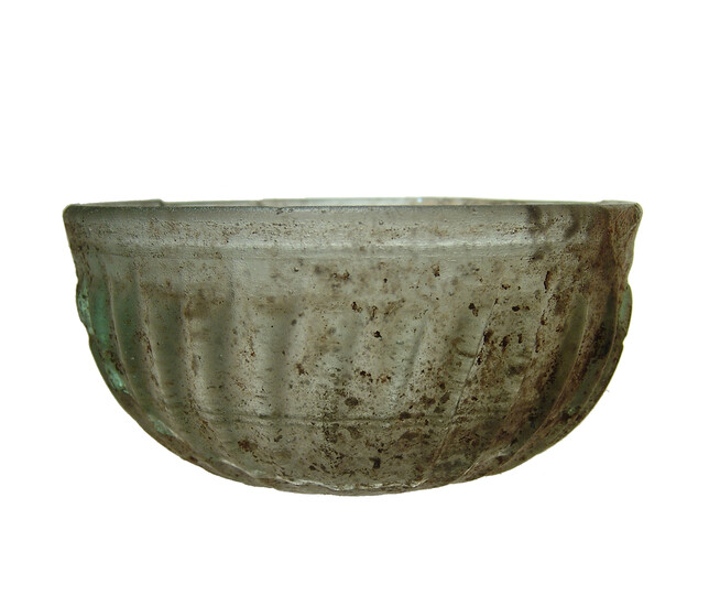 An attractive deep ribbed Roman glass bowl