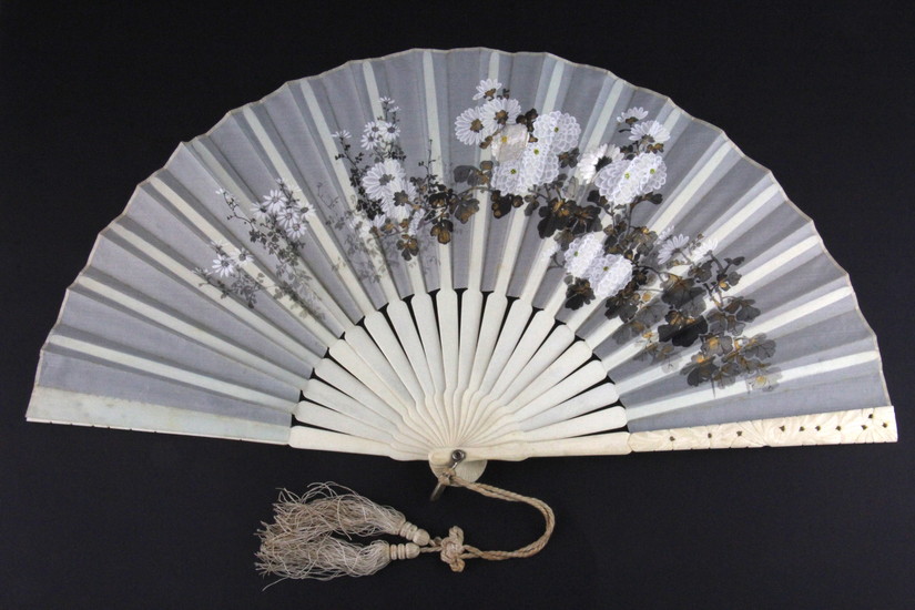 An early 20th century Chinese carved ivory mounted hand painted and embroidered silk fan, L. 21cm.