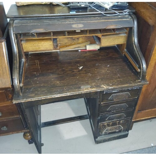 An early 20th century single pedestal desk with 'S' scroll r...