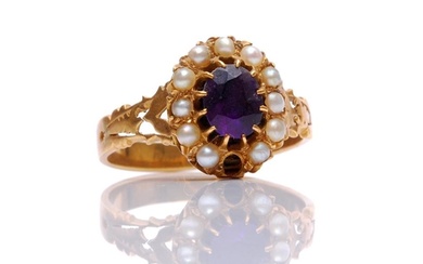 An unmarked amethyst and seed pearl memorial ring, central a...