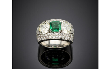 BULGARI Platinum ring with two round diamonds and a step cut ct. 1.30 circa emerald accented with pavé and small...