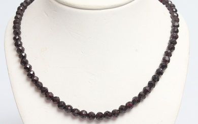 Bohemian garnet necklace with gold clasp A luxurious necklace of faceted garnets with a large gold clasp in the shape of a multi-faceted ball. High-quality Bohemian garnets saturated in dark color. Latvian Assay office tags.