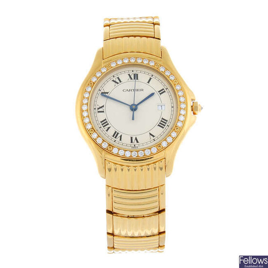 CARTIER - an 18ct yellow gold Cougar bracelet watch, 33mm.