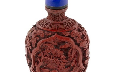 CHINESE CARVED CINNABAR SNUFF BOTTLE Early 20th Century Height 2.75". Blue glass stopper.