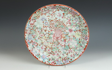 CHINESE FAMILLE ROSE FLORAL DECORATED PORCELAIN CHARGER ON RUST GROUND....