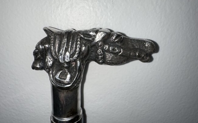 Cane with sterling silver handle of horse